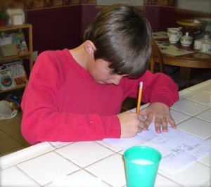 My own son writing his own letter to Santa at the tender age of eight. His list was much different from mine.